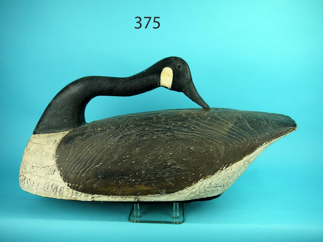 CANADA GOOSE, NETTLE CREEK: CANADA GOOSE, Nettle Creek Classic Gallery. Preening model in antiqued paint and condition. Raised grain pattern overall. Retains felt bottom. 200-300