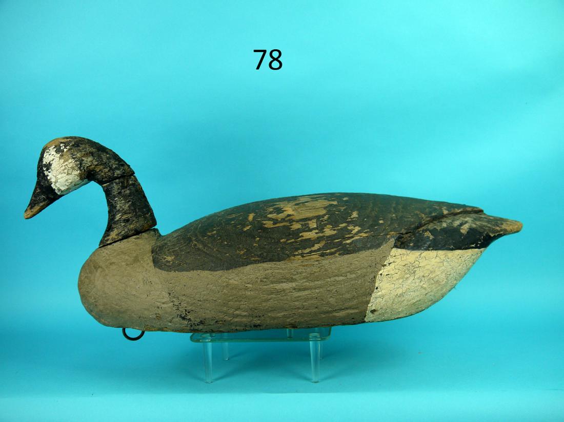 EARLY CANADA GOOSE, VIRGINIA: EARLY CANADA GOOSE, possibly Virginia. Very old working paint worn to wood in areas. Fair structural condition. Numerous checks to head secured with nails. Carved wings to back. Bottom hollowed out fo