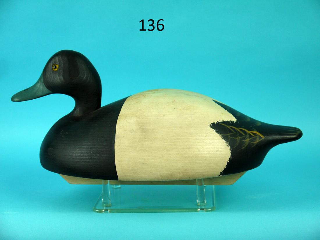 BROADBILL DRAKE, WILDFOWLER: BROADBILL DRAKE by the Wildfowler Decoy Company, Bohemia, NY. Excellent original paint and unused condition. Painted feather work to top rear. Head turned slightly left. Retains glass eyes. Full keel 