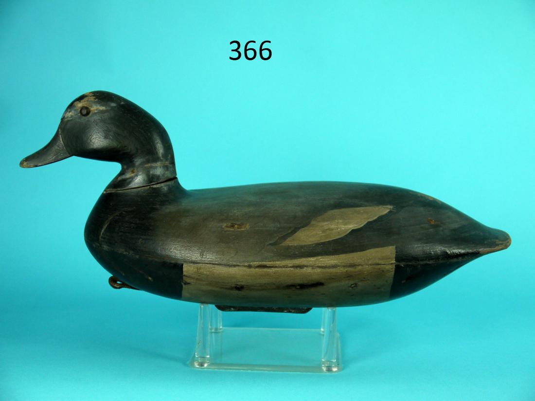 BROADBILL DRAKE, BLAIR STYLE: BROADBILL DRAKE carved in the style of John Blair. Very good restored paint and structural condition. Nail holes visible to sides. Small chip to underside of tail. Retain weight and rigging. Branded J