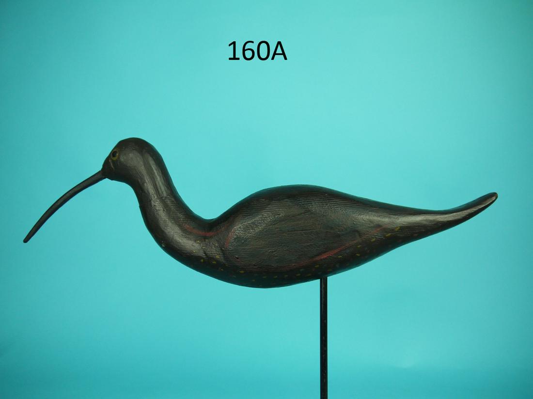 CURLEW, CAPE MAY, NJ: CURLEW, possibly Cape May, NJ. Appears to be original paint. Very good structural condition. Old repair where bill meets face. Retains shoe-button eyes. Overall length is approximately 16 inches. 150-