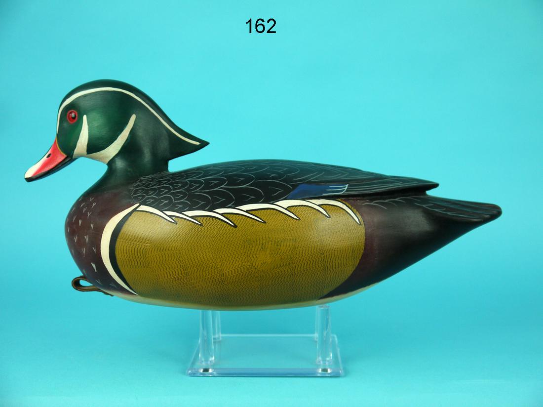WOOD DUCK DRAKE, C. FENNIMORE: WOOD DUCK DRAKE by Clarence Fennimore, Wrightstown, NJ. Very good original paint and structural condition. Hollow construction. Painted feather detail to back. Comb feather paint to sides. Raised carv