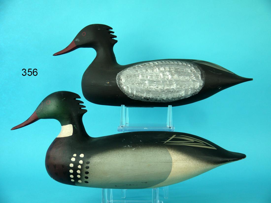 RED-BREASTED MERGANSER PAIR, BARNEGAT BAY DECOY CO.: PAIR OF RED-BREASTED MERGANSERS by the Barnegat Bay Decoy Co., Pt. Pleasant, NJ. Very good original paint and structural condition. Some minor shelf rubs to both. Gunning models with painted wing deta
