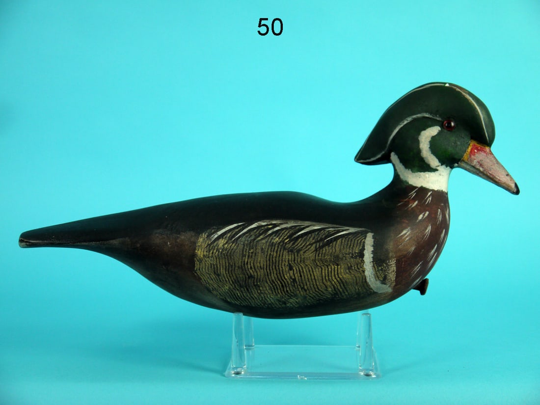 WOOD DUCK DRAKE, G. GARTON: WOOD DUCK DRAKE by George "Coot" Garton, Fairfield, NJ. Good original paint and structural condition. Small paint rub to top of head. Comb paint detail to sides and broad carved tail. Head slightly tu