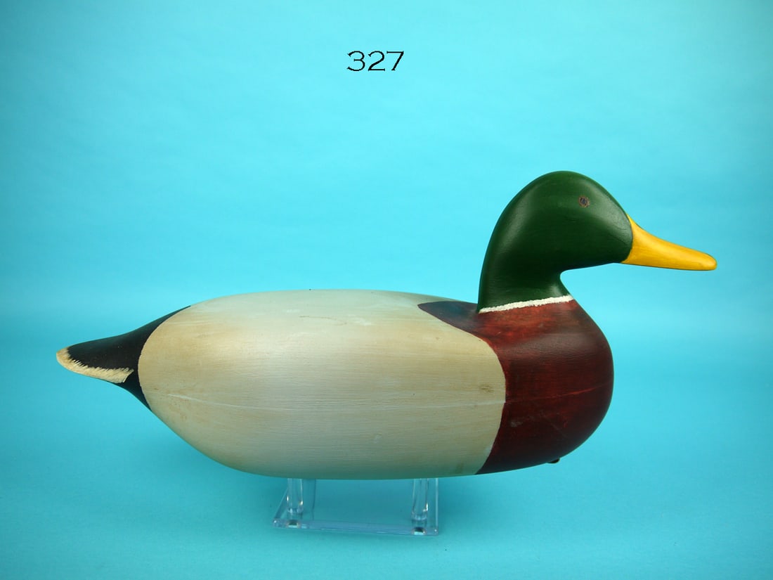 MALLARD DRAKE, O. WETMORE: MALLARD DRAKE by O. "Buck" Wetmore. Very good original paint and structural condition. Some discoloration to the body. Hollow construction. Retains weight and leather rigging. Signed by maker and date