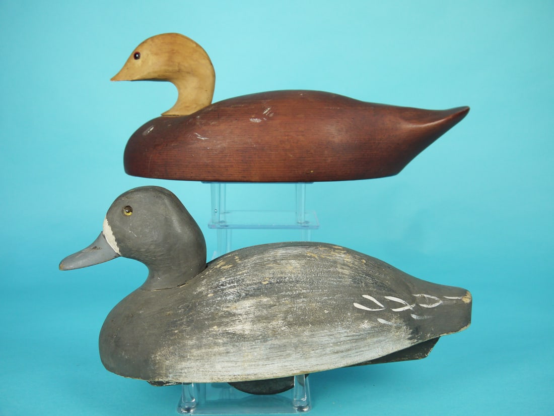 TWO WILDFOWLER DECOYS: BLUEBILL HEN by the Wildfowler Decoy Co., Old Saybrook, CT. Working paint with some flaking and in-use wear. Good structural condition with sliver on mid-back. Dowelled head is loose. Balsa constructi