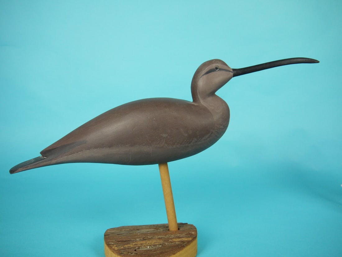 CURLEW, H. CONKLIN: CURLEW by Hurley Conklin, Manahawkin, NJ. Very good original paint and structural condition. Split-tail carving and carved eyes. Branded "H.C". Mounted atop a custom base that is signed "H. CONKLIN