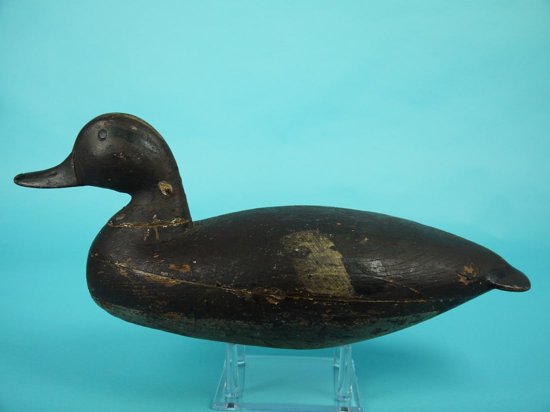 WIGEON DRAKE, J.T. CRANMER: RARE WIGEON DRAKE by Joe Tom Cranmer, Manahawkin, NJ. Early working paint and good structural condition. Carved eyes, nostrils and nail. Retains pad weight. Overall length is approximately 15 inches.