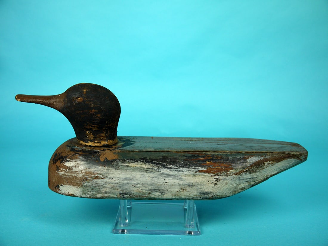 AMERICAN MERGANSER DRAKE, STARR COLLECTION: EARLY AMERICAN MERGANSER DRAKE from the collection of Dr. George Ross Starr, Jr. Working paint worn to wood in areas. Good structural condition with some tight checks to body. Solid construction.