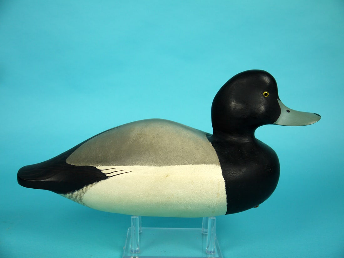 BLUEBILL DRAKE, W. CRANMER: BLUEBILL DRAKE by William Cranmer, Beach Haven, NJ. Very good original paint and structural condition. Hollow construction. Retains glass eyes. Signed by maker and dated 1976. Also branded SIGC