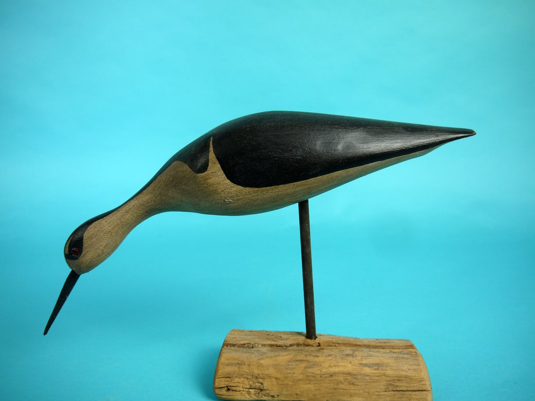 STILT, H.V. SHOURDS: BLACK-NECKED STILT by Harry V. Shourds, Seaville, NJ. Very good original paint and structural condition. Feeding model with carved eyes. Signed by maker and mounted on a custom base. Overall length