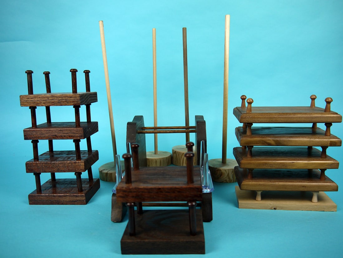 GROUP OF DECOY STANDS: GROUP OF DECOY STANDS consisting of six wood stands (4" x 3 3/8"), five wood stands (3 3/8" x 6"), one lucite stand (4 1/2 " x 6 1/2") , wood stand for two decoys (11" x 5") and four wood stands