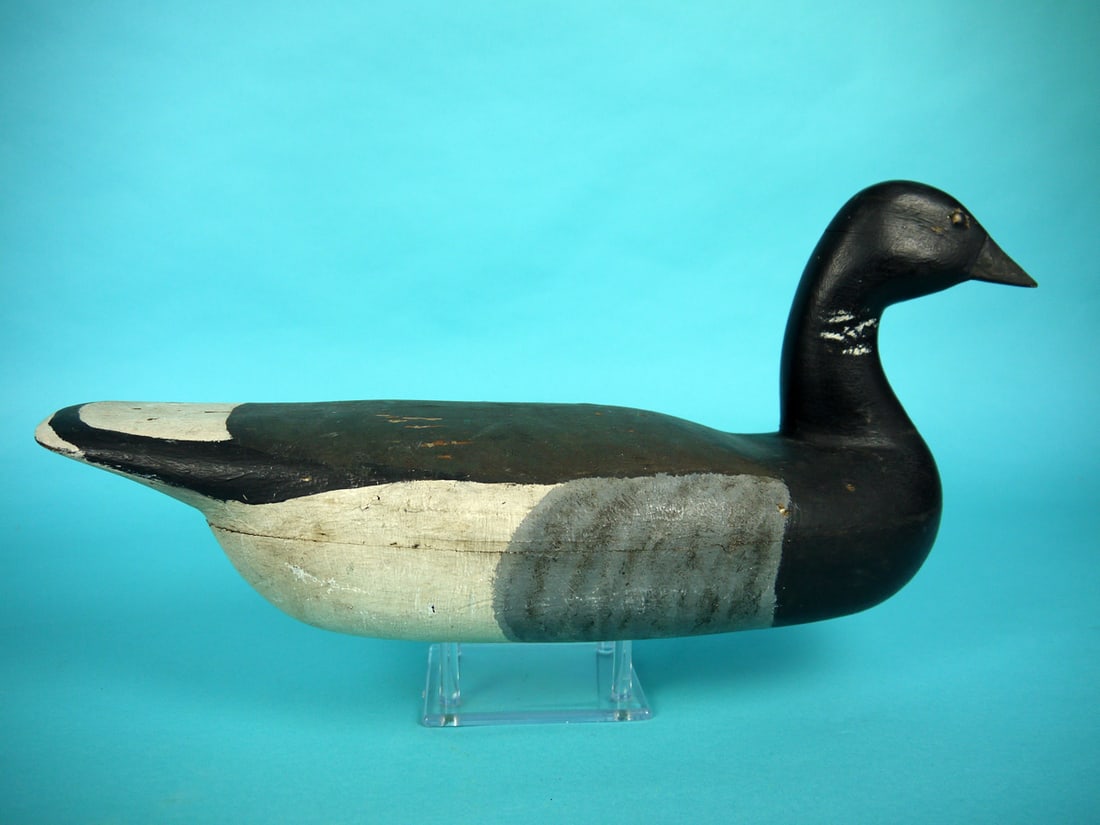 BRANT, NEW JERSEY: BRANT, New Jersey, unknown carver. Working paint with in-use wear. Good structural condition with crack through top and bottom of tail. Hollow construction. Slightly turned head. Retains tack eyes. We