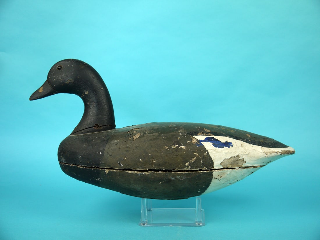 BRANT, NEW JERSEY: BRANT, New Jersey, unknown maker. Working paint and good structural condition. with in-use wear. Tight check to one side of neck. Retains pad weight. Overall length is approximately 18 inches. 75-100