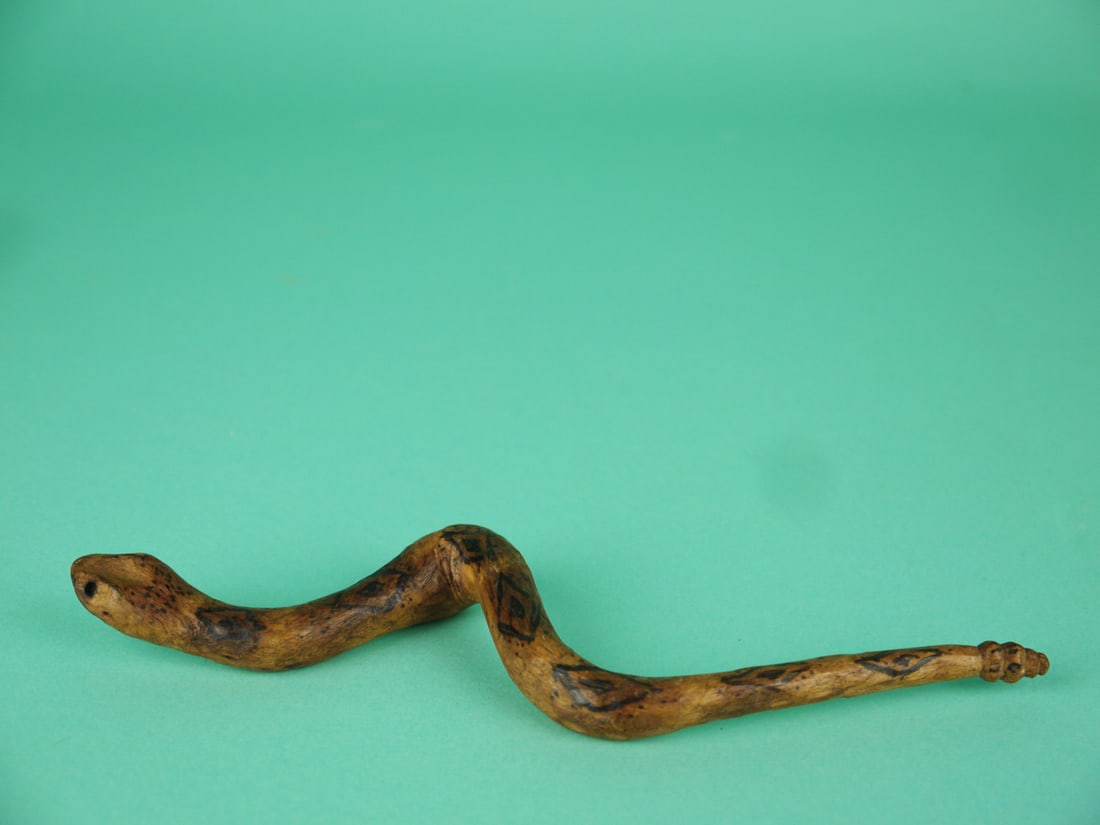 MINIATURE RATTLESNAKE, R. ALLEN: MINIATURE RATTLESNAKE by Russ Allen, Parksley, VA. Natural finish with painted pattern to body. Carved detail to head and tail. Overall length is approximately 7 3/4 inches. Signed (ra) by maker. An