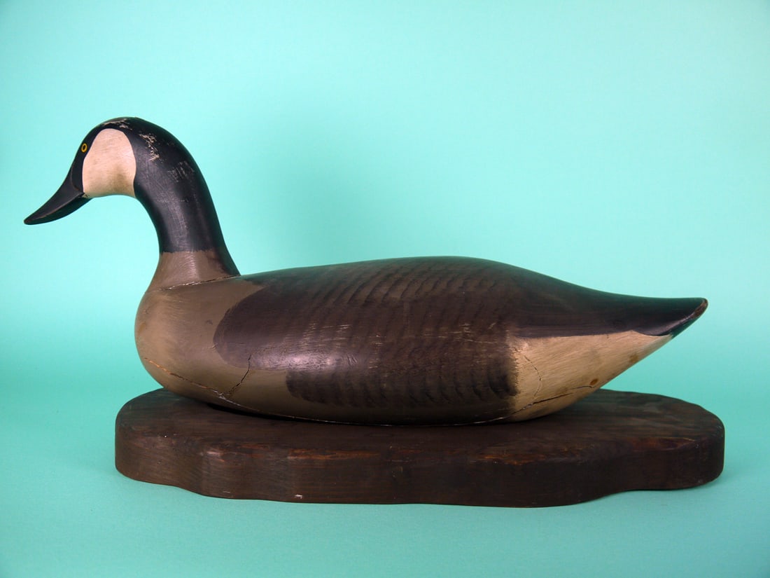 CANADA GOOSE, UPPER BAY, MD: CANADA GOOSE, Upper Bay, MD. Good original paint with rub to top of head. Good structural condition with checks to underside of body. Weight removed. Together with a custom base. Overall length is app