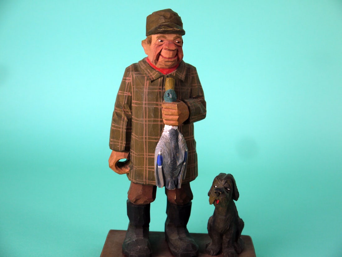 HAND-CARVED DUCK HUNTER, C.O. TRYGG: WHIMSICAL HAND-CARVED DUCK HUNTER by Swedish folk artist Carl Olaf Trygg (1910-1993). Very good original paint and structural condition. Knife-cut style with very detailed carving to face, hunting