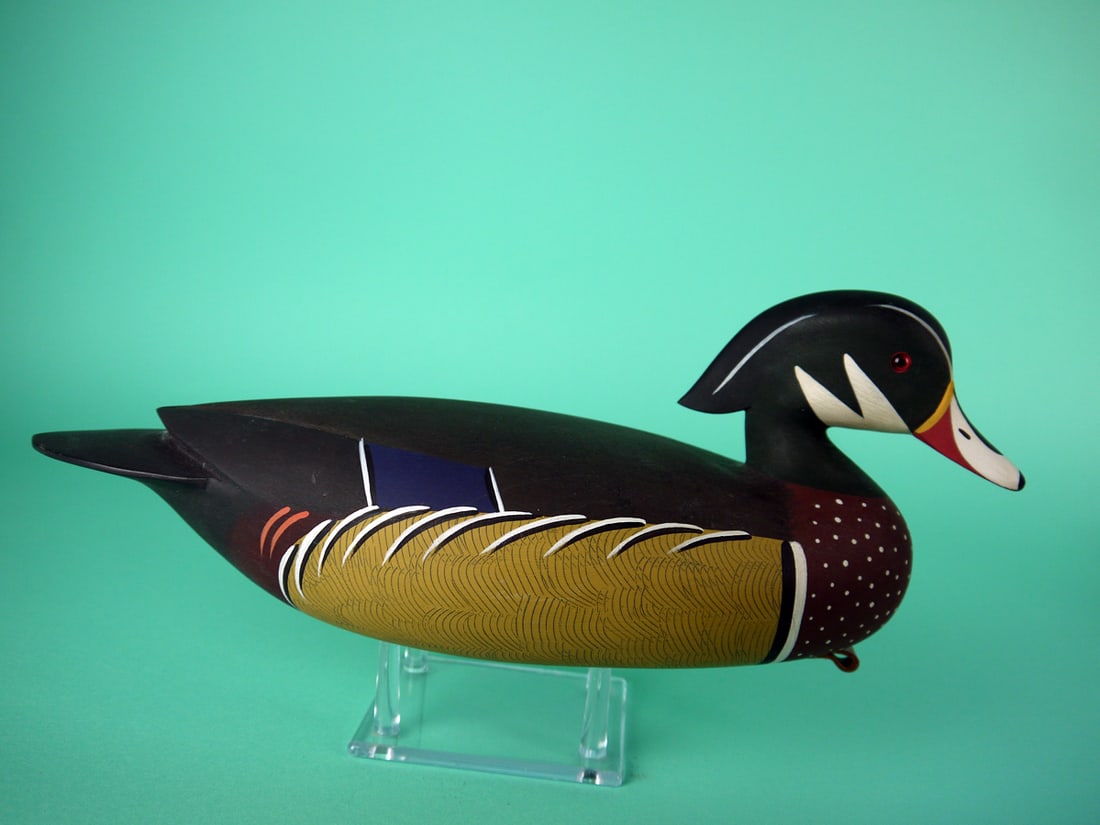 WOOD DUCK DRAKE, J.P. HAND: FINE WOOD DUCK DRAKE by Jamie P. Hand, Cape May Courthouse, NJ. Very good original paint and structural condition. Hollow construction. Raised wing tips and painted feather detail to sides. Slightly t