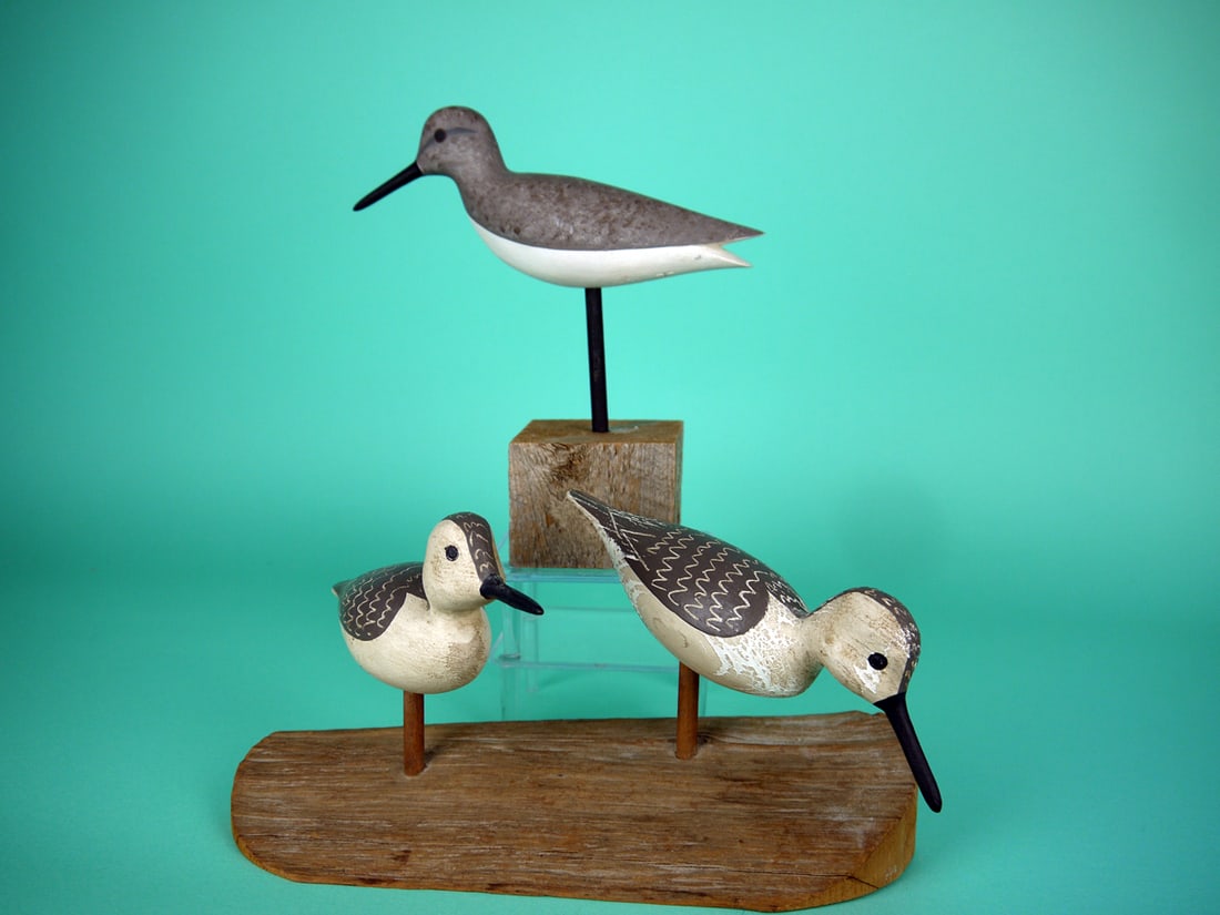 THREE SHOREBIRDS, J.P. HAND: THREE SHOREBIRDS by Jamie P. Hand, Cape May Courthouse, NJ, consisting of two peeps and a yellowlegs. Two are in very good original paint. One peep with sap bleed overall. All with maker's brand and