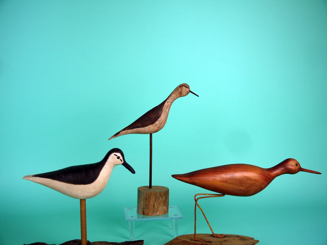 THREE SHOREBIRDS: GROUP OF THREE SHOREBIRDS by unknown carvers. All in good condition. Two with original paint, one in a natural finish. All on custom bases. Sizes range from 8 inches to 11 1/2 inches. 75-100
