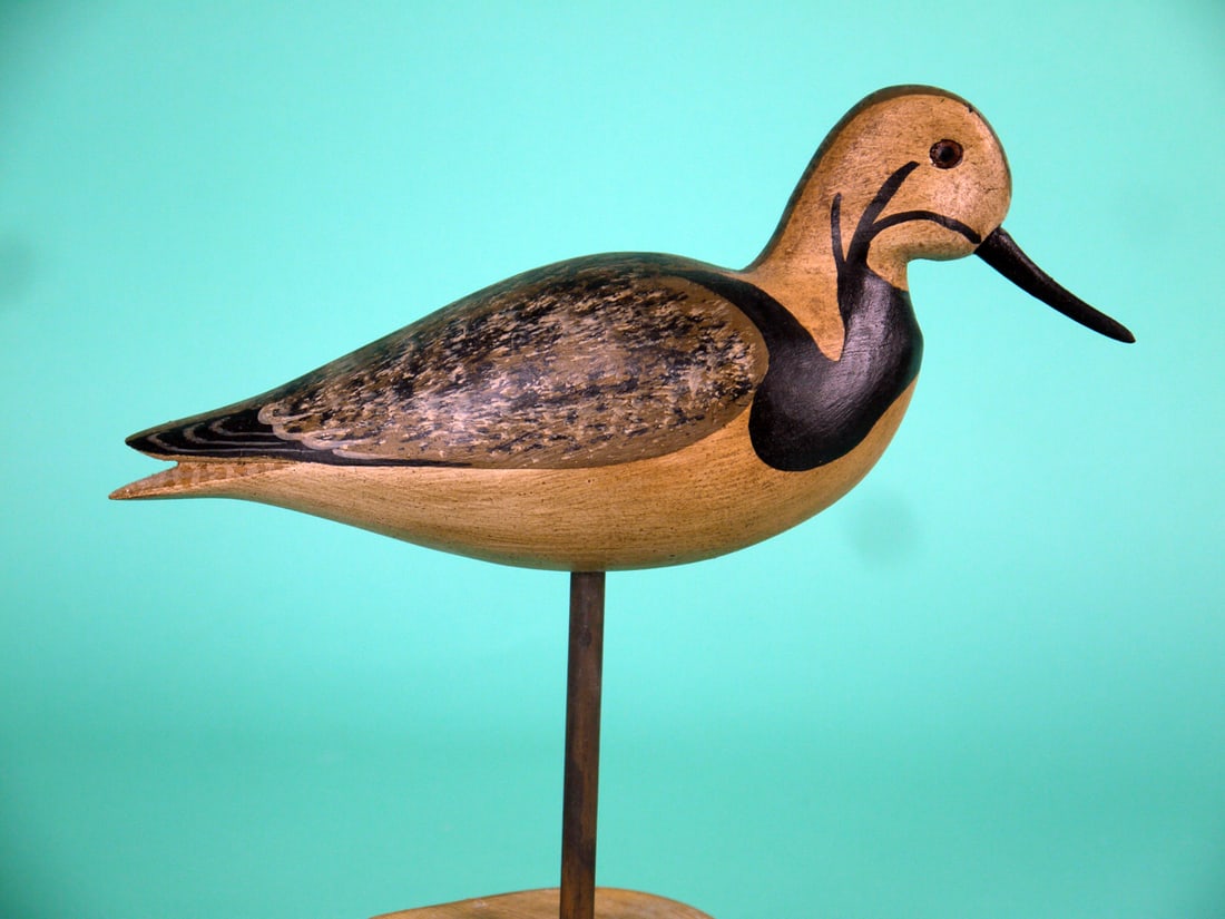 RUDDY TURNSTONE, H.V. SHOURDS: RUDDY TURNSTONE by Harry V. Shourds, Seaville, NJ. Very good original paint and structural condition. Split-tail carving and carved eyes. Signed by the maker. Mounted on a custom base. Overall length 