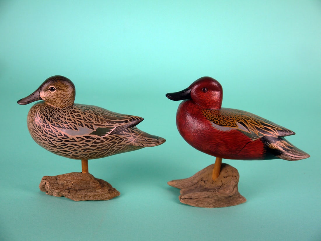 MINIATURE CINNAMON TEAL, J. WOOD: VERY FINE PAIR OF MINIATURE STANDING CINNAMON TEAL by John Wood, Venice, FL. Both with fine detailed painted feather work overall and very fine paint ticking to the heads. Both with snug heads and det