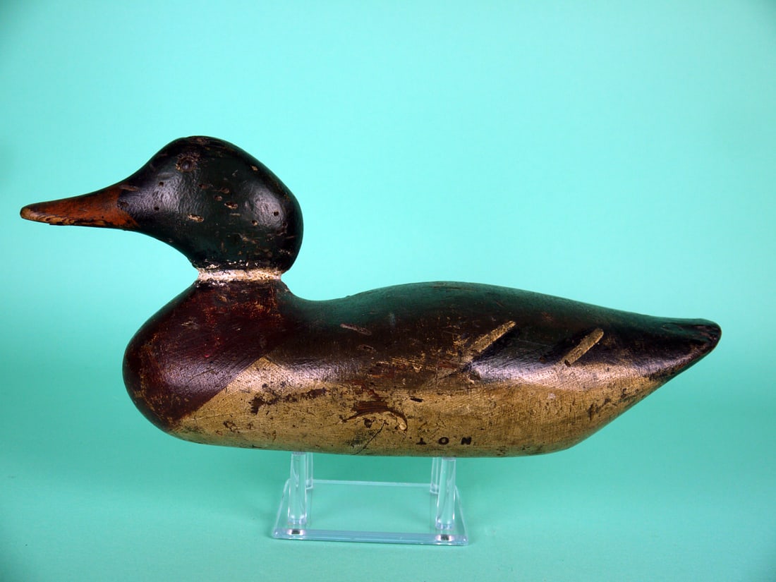 MALLARD DRAKE, DODGE: MALLARD DRAKE by the Dodge Decoy Factory, Detroit, MI. Working paint and good structural condition. Shot scars to body and head. Chip to tail edge. Tight body check. Retains tack eyes. Branded NOT