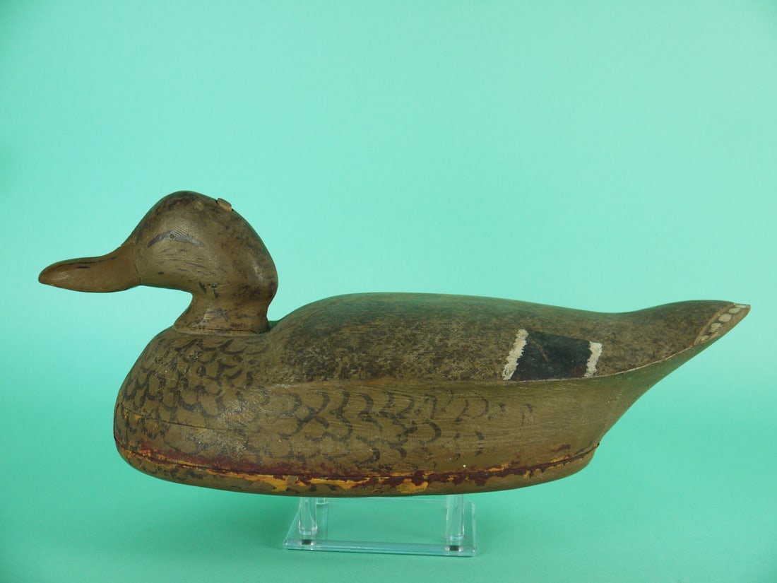 MALLARD HEN, MIDWEST: EARLY MALLARD HEN, Mid-West, by an unknown carver, circa 1930s. Very good original paint and structural condition. Head dowel slightly raised. Some discoloration to seam where bottom board meets