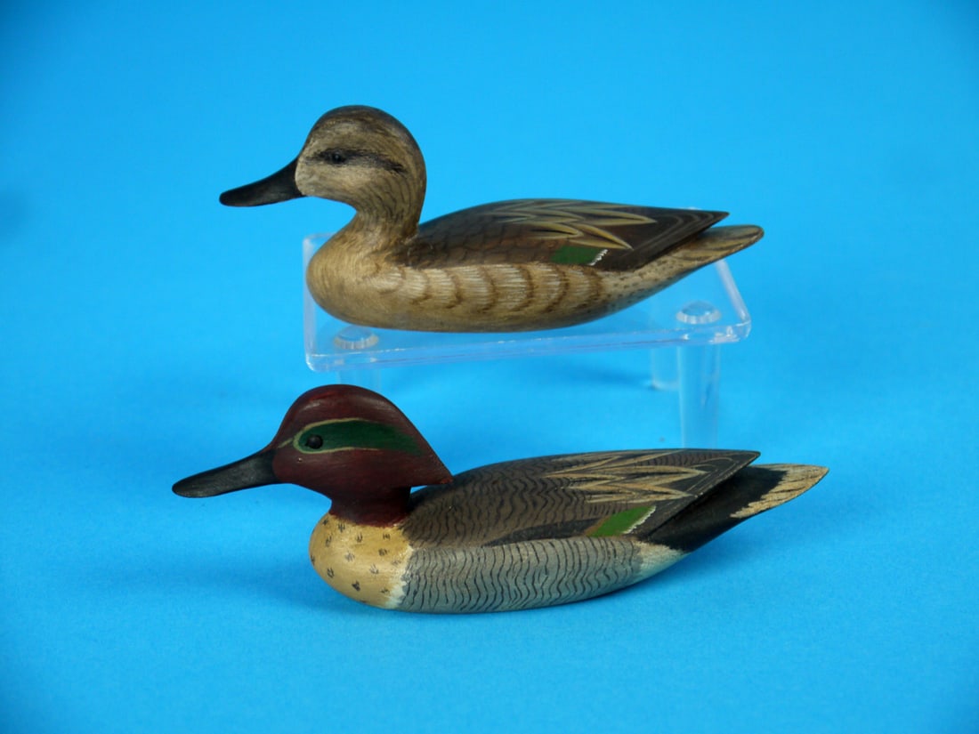 MINIATURE GREEN WING TEAL DRAKE/HEN. W. JOHNSON: GREEN WING TEAL DRAKE AND HEN by William Johnson, Virginia Beach, VA. Excellent original paint and condition. Painted feather detail and raised wing tips. Both signed by the maker. The drake is 5 inch