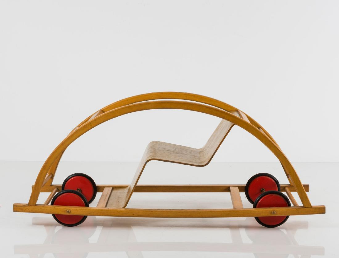 Rocking car, 1950: Hans Brockhage, H. 41.5 x 90 x 38.5 cm. Beech, beech ply, red wheels, rubber.
