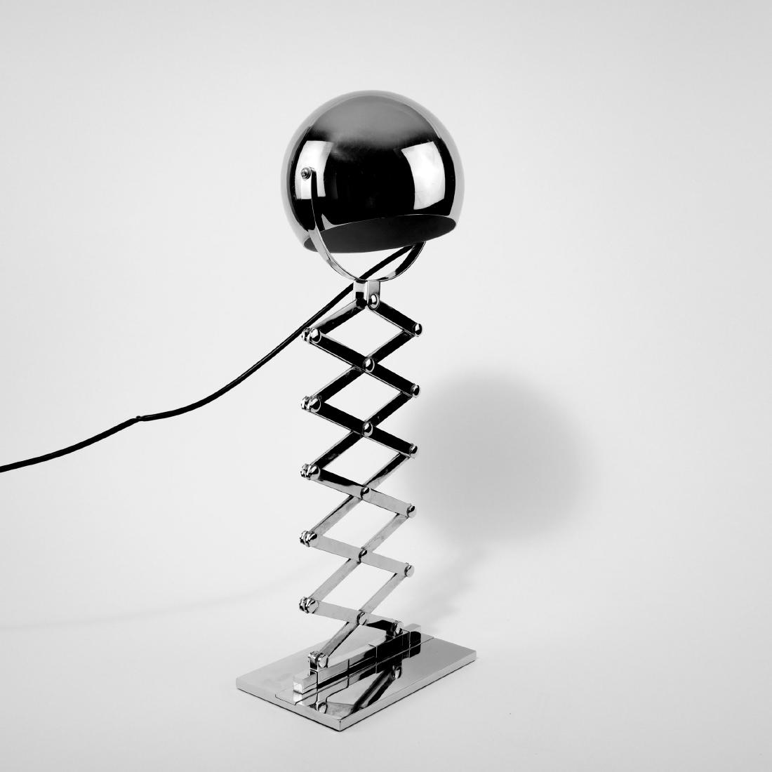 'Scissor' lamp, 1968: Dorothee Becker, H. 88.5 cm (max.). Made by Design M, Ingo Maurer, Munich. Chrome-plated sheet metal and cast metal.