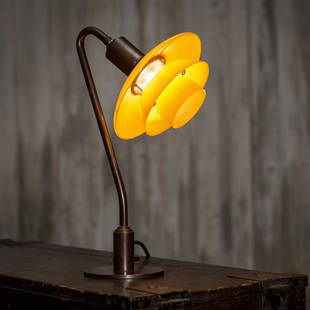 '2/2' table light, 1931: Poul Henningsen, H. 39.5 cm. Made by Louis Poulsen, Copenhagen. Cast brass, tubular brass, sheet brass, dark patina, yellow glass. Marked: PH 2.