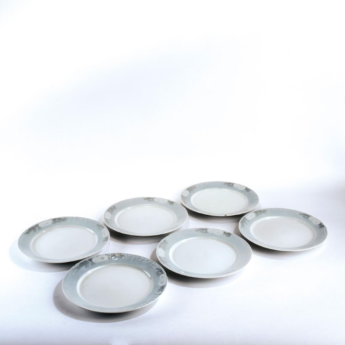 Six 'Marguerites' dining plates, 1899: Royal Copenhagen, Shape and dŽcor designed by: Arnold Krog in the 1890s; handle and knobs: Andrea Pedersen and Theodor Madsen, 1899. Made between 1985-91 (plates and tray). Porcelain, white, glazed,