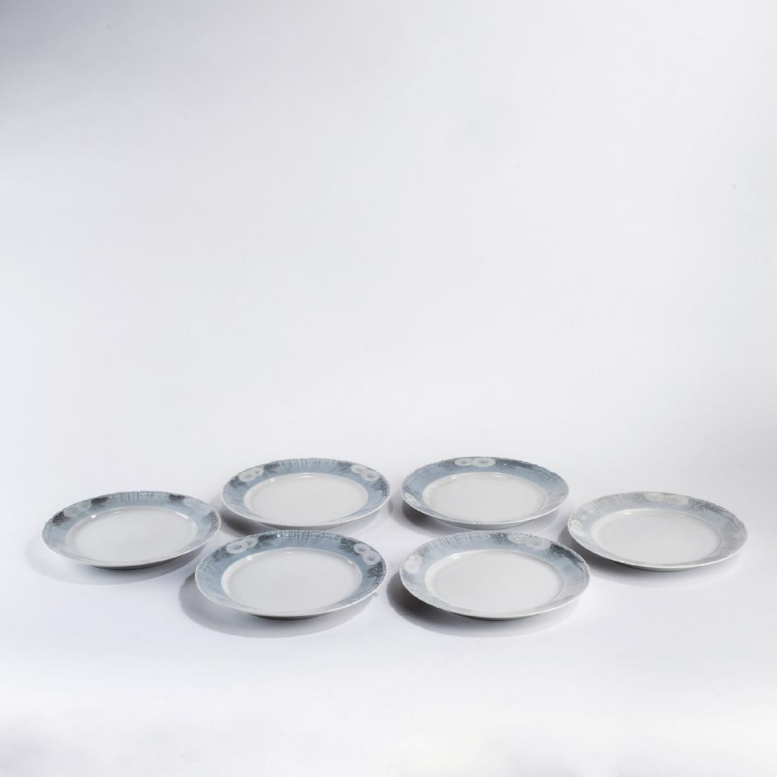 Six 'Marguerites' starter plates, 1899: Royal Copenhagen, Shape and dŽcor designed by: Arnold Krog in the 1890s; handle and knobs: Andrea Pedersen and Theodor Madsen, 1899. Made between 1985-91 (plates and tray). Porcelain, white, glazed,