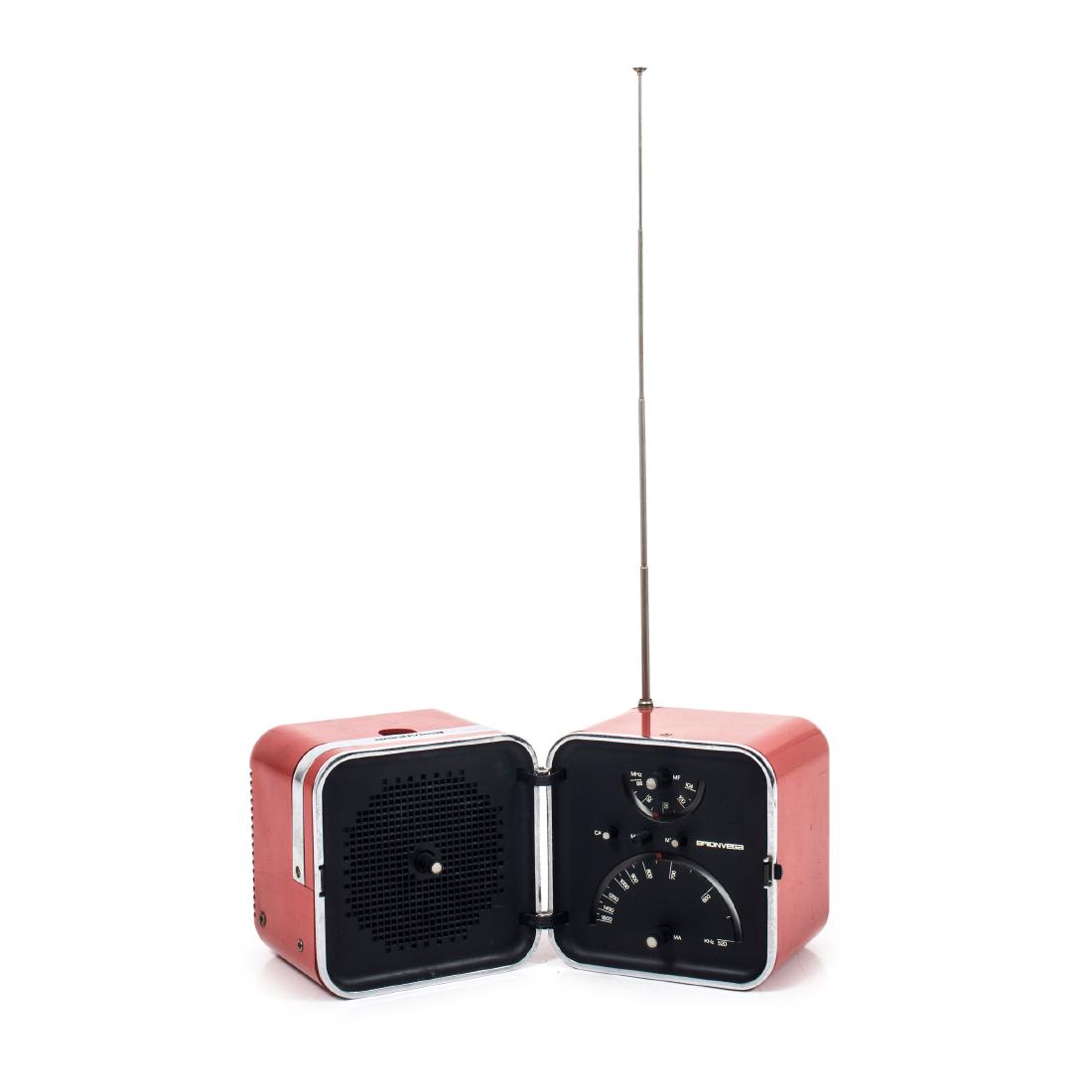'TS 502' radio, 1964: Richard Sapper; Marco Zanuso, H. 13 x 26.5 x 13 cm (open). Made by Brionvega, Milan. Red plastic, metal handle. Marked: Brionvega ts 502, MADE IN ITALY.