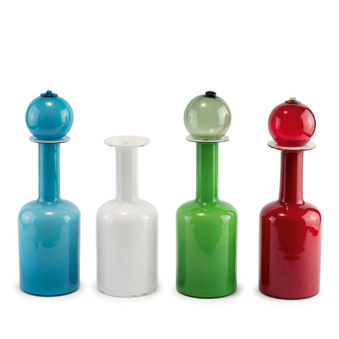 Four bottles, 1950s: Otto Brauer, H. 31-32 cm. Made by Holmegaard Glasvaerk, Copenhagen. Glass, opal white, green, red and light blue.