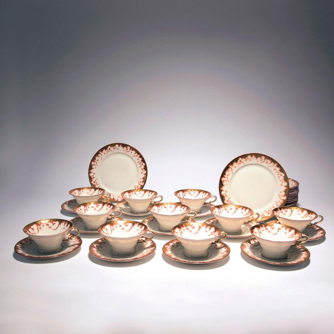 Twelve 'Madeleine' coffee cups and biscuit plates, 1927: Rosenthal, Selb, 12 coffee cups with saucers, H. 5.3 cm; 12 biscuit plates, Diameter 19.5 cm. Designed by Friedrich Fleischmann. Made c. 1927-34. Porcelain, white, glazed, overglaze, auburn with gold.