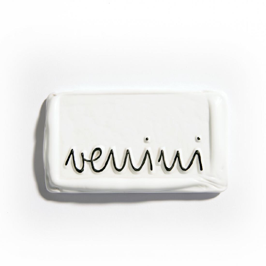 Venini & C., Murano, Venini plaque, 1950s: Venini & C., Murano, 9 x 16 cm. White glass matter with textured lettering: venini; black enamel.