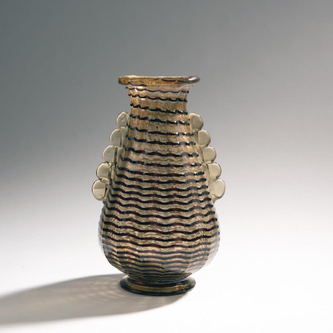 Ercole Barovier, 'Avventurina' vase, 1936: Ercole Barovier, H. 29,5 cm. Made by Ferro Toso Barovier. Clear ribbed cased glass with fused aventurin powder and dark violet threads, part in amber color.