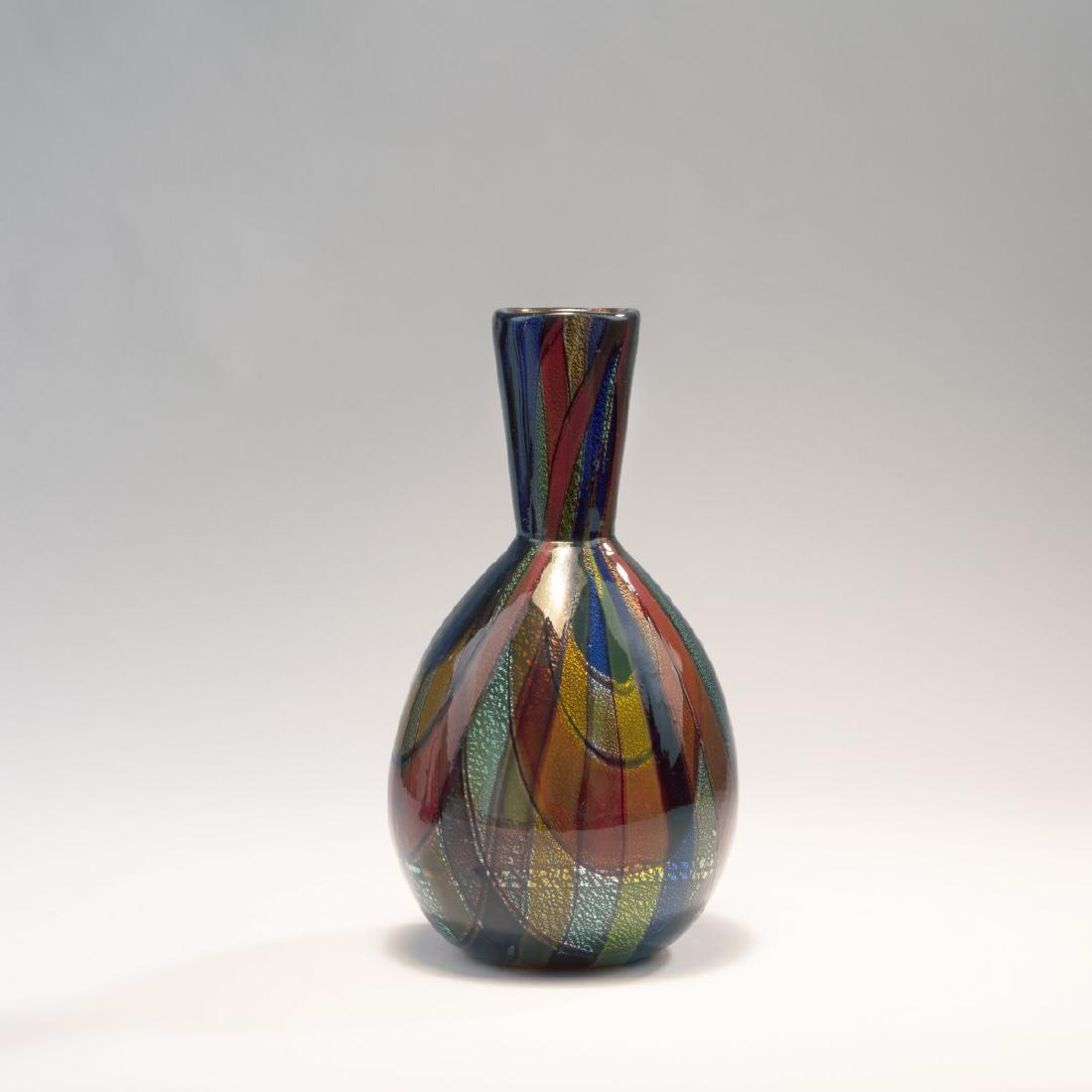 Ercole Barovier, 'Oriente' vase, c. 1940: Ercole Barovier, H. 28 cm. Made by Barovier & Toso. Cased glass, clear, fused ribbons, blue, green, red, yellow, orange and purple, threads, dark purple on burst gold foil.