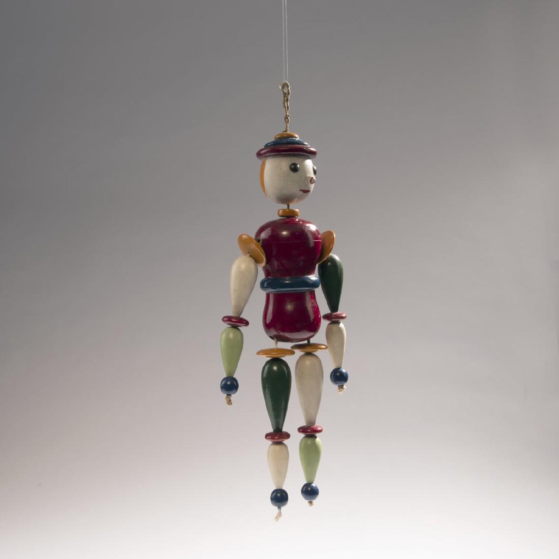 Oskar Schlemmer, Manikin, 1922: Oskar Schlemmer, Manikin, 1922, H. 37.5 x 37.5 x 6.5 cm. Made by Josef Hartwig. Turned wood, painted, clear lacquer in parts; Hemp and cotton cord., Magdalena Droste, Bauhaus 1919-1933, Berlin 2013 (1