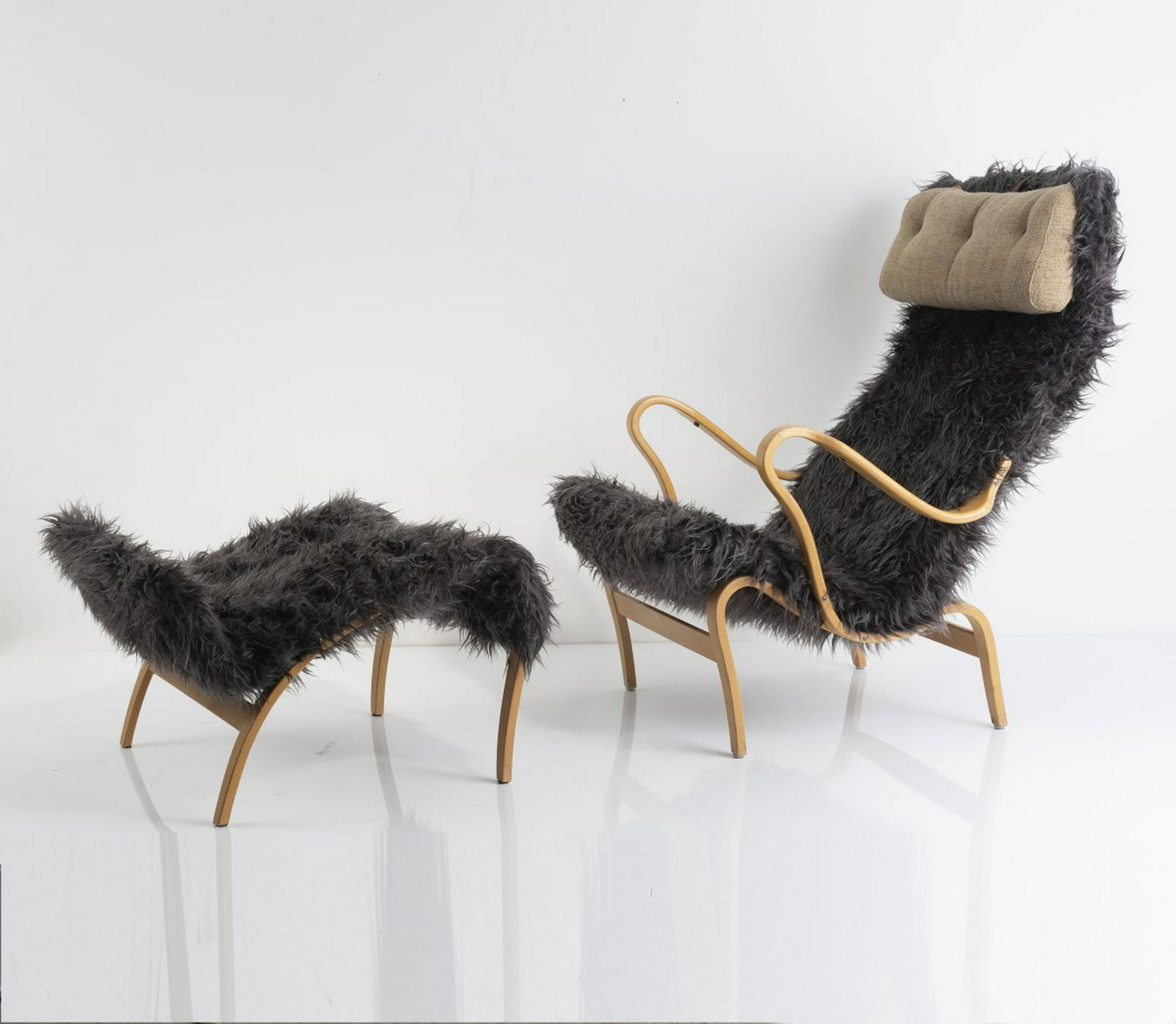 B. Mathsson, 'Pernilla' chair w. footrest, c1934: B. Mathsson, 'Pernilla' chair w. footrest, c1934, Bruno Mathsson. 'Pernilla' chair with footrest, c. 1934. H. 99 x 76 x 91 cm; H. 42 x 63 x 66.5 cm. Made by DUX, Trelleborg, in the 1960/70s. Birch, bi