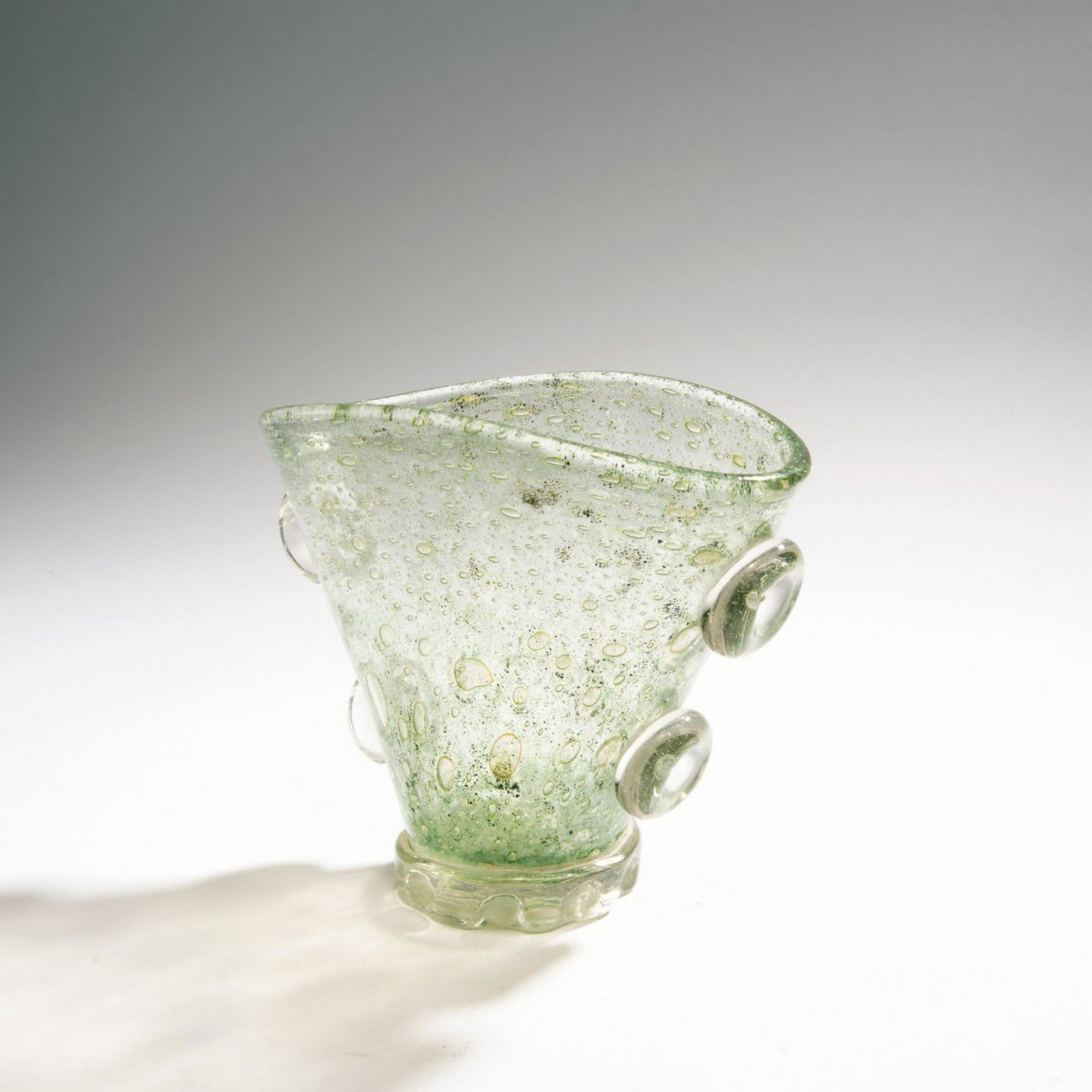 Ercole Barovier, 'Spuma di mare' vase, 1938-40: Ercole Barovier, 'Spuma di mare' vase, 1938-40, H. 17,8 cm. Cased clear glass with oxide fusions in shades of green and bubbles; applied clear handles., Marino Barovier, Venetian Art Glass, Stuttgart 