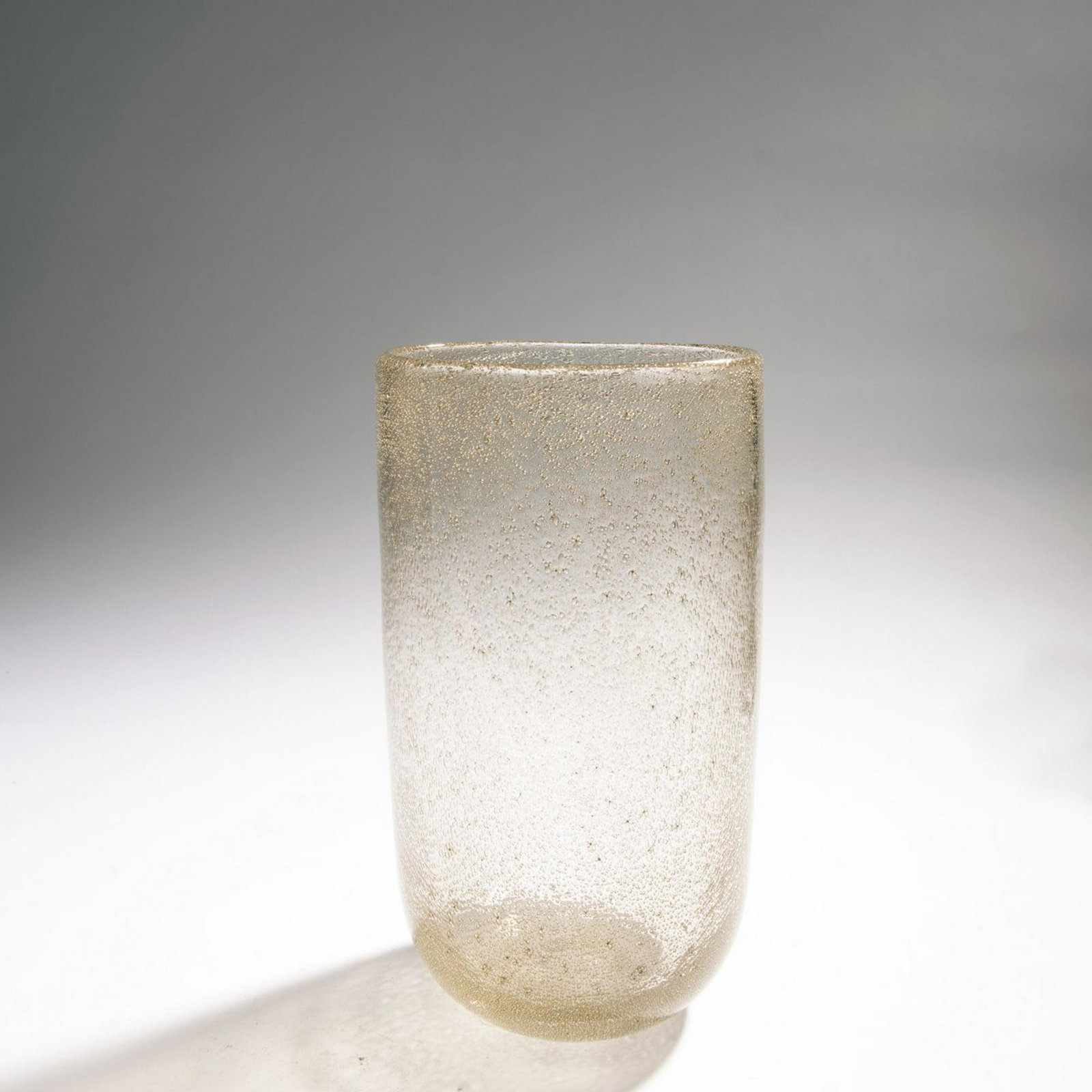 F. Poli, 'A bollicine metalliche' vase, c. 1937: F. Poli, 'A bollicine metalliche' vase, c. 1937, 'A bollicine metalliche' vase, c. 1937. H. 25.3 cm. Execution: Seguso Vetri d'Arte. Cased glass, colorless with gold-colored bubble inclusions., Cf. Ma