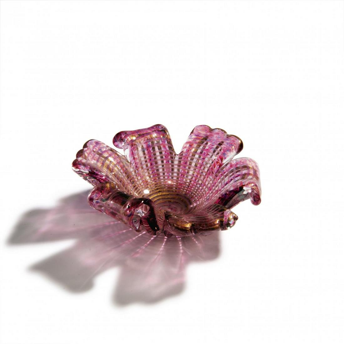 Ercole Barovier,: Ercole Barovier, 'Zebrato' bowl, 1949, Flower shape with vertical ribs. H. 7.5 cm; D. 21.5 cm. Execution: Barovier & Toso, Murano. Cased glass, clear, powder inclusions in red, fine horizontal stripes