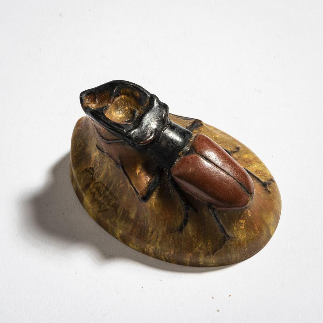 Amalric Walter, Paperweight, c1925: Amalric Walter, Nancy , Paperweight 'Lucane cerf-volant', c. 1925, Stag beetle. H. 4.8 cm. Pâte de verre, translucent glass, melted, predominantly brown, relief beetle with auburn and black powd