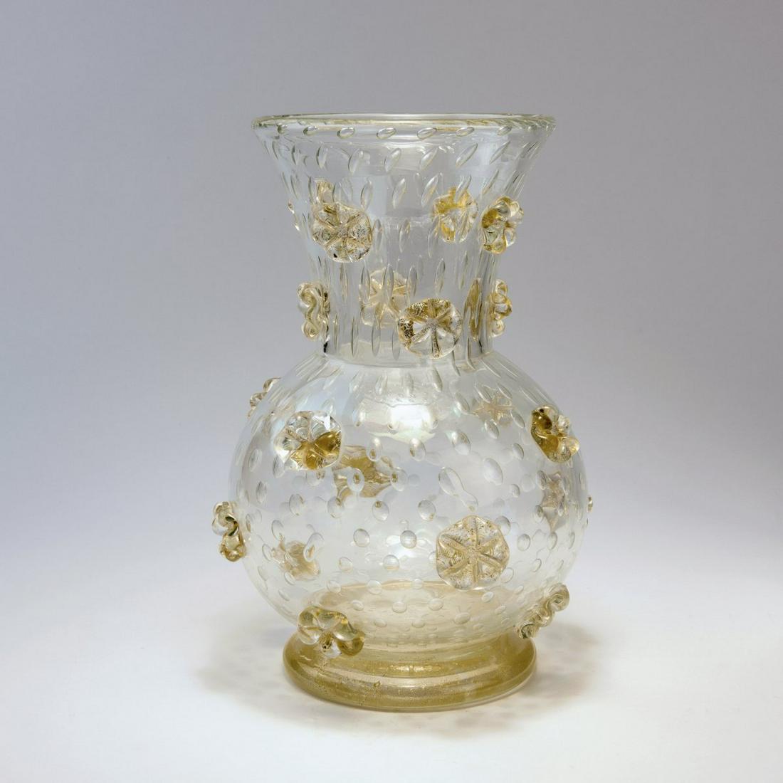 Ercole Barovier, 'A stelle' vase, 1942: Ercole Barovier, 'A stelle' vase, 1942, H. 30 cm. Execution: Barovier & Toso. Clear glass, pricked air bubbles, embossed nodes. Nodes and foot with burst gold foil. , Cf. Attilia Dorigato, Ercole 
