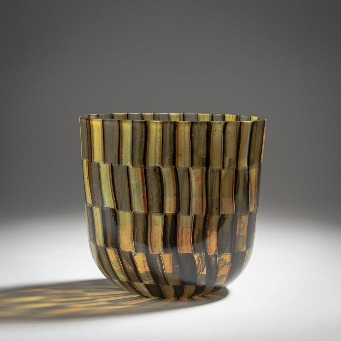 Ercole Barovier, 'Moreschi' vase, 1957: Ercole Barovier, 'Moreschi' vase, 1957, Heavily flattened round shape. H. 19 cm. Execution: Barovier & Toso. Clear glass with melted rectangular plates in opalescent brown and gray. Marked on the 