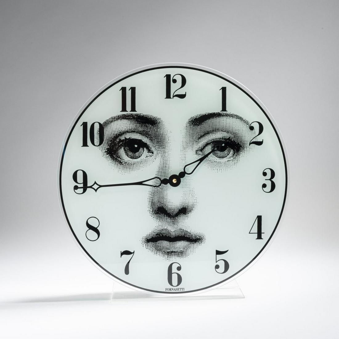Barnaba Fornasetti, Wall clock 'Viso', 1990/2000s: Barnaba Fornasetti, Wall clock 'Viso', 1990/2000s, D. 37 cm. Made by Fornasetti, Milan. Foil on glass, white and black. Marked: FORNASETTI.,