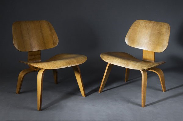 Charles Eames. Pair of 'LCW', designed in 1945/4: Charles Eames. Pair of 'LCW', designed in 1945/46. H. 67 x 56.6 x 60 cm. Made by Evans Products, Gardena, c. 1948. Walnut wood, rubber shock-mounts and metal screws. Very early execution, pre-Herman M